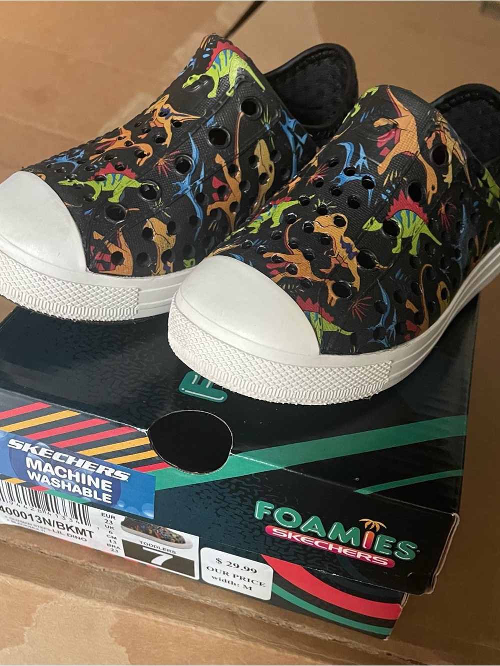 Skechers Kids Black Slip-On Sneakers with Colorful Dinosaur Print